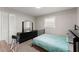 Comfortable bedroom with a full-size bed and dresser at 1283 Woodleigh Sw Rd, Marietta, GA 30008