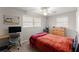 Spacious bedroom with a bed, desk, and window at 1283 Woodleigh Sw Rd, Marietta, GA 30008