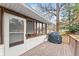 Deck with grill, screened porch view, and backyard access at 1283 Woodleigh Sw Rd, Marietta, GA 30008