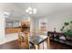 Open dining area with glass table and wood chairs at 1283 Woodleigh Sw Rd, Marietta, GA 30008