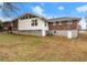 House exterior showcasing back of house and yard at 1283 Woodleigh Sw Rd, Marietta, GA 30008