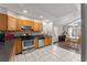 Kitchen with oak cabinets, stainless steel appliances, and a dining area at 1283 Woodleigh Sw Rd, Marietta, GA 30008