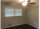 Bright bedroom with dark hardwood floors and ceiling fan at 85 Valleybrook Dr, Fairburn, GA 30213