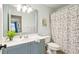 Small bathroom with shower/tub combo and polka dot curtain at 976 Arthur Nw Ln, Atlanta, GA 30318