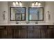 Double vanity bathroom with large mirrors at 3109 Bentley Farms Dr, Loganville, GA 30052