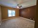 Spacious bedroom with wall-to-wall carpet and large window at 503 Champions Pt, Johns Creek, GA 30097