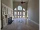 Gathering room with hardwood floors and fireplace at 503 Champions Pt, Johns Creek, GA 30097