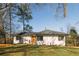 Newly renovated house with white siding, gray roof, and manicured lawn at 519 Lemon Ne St, Marietta, GA 30060