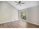 Bright bedroom featuring hardwood floors and a ceiling fan at 2830 Jodeco Dr, Jonesboro, GA 30236