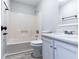 Clean bathroom with a shower/tub combo and white vanity at 6235 Queens Rd, Douglasville, GA 30135