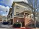 Three-story building with brick and siding, private entrance, and attached garage at 655 Mead St # 28, Atlanta, GA 30312