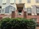 Townhouse entrance with brick accents and landscaping at 655 Mead St # 28, Atlanta, GA 30312