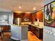 Modern kitchen with wood cabinets, granite counters, and stainless steel appliances at 655 Mead St # 28, Atlanta, GA 30312