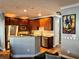 Modern kitchen with wood cabinets, granite counters, and stainless steel appliances at 655 Mead St # 28, Atlanta, GA 30312