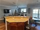 Open concept kitchen with granite island, wood cabinets, and hardwood floors at 655 Mead St # 28, Atlanta, GA 30312