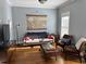 Cozy living room showcasing hardwood floors, a comfy couch, and armchairs at 655 Mead St # 28, Atlanta, GA 30312