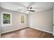 Spacious bedroom with wood-look floors and ceiling fan at 3333 Devaughn Ne Dr, Marietta, GA 30066