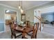 Bright dining room featuring a wood table and chairs, kitchen views, and access to the living room at 1131 Brogdon Dr, Powder Springs, GA 30127