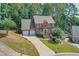 Brick home with a two-car garage and manicured lawn at 1131 Brogdon Dr, Powder Springs, GA 30127