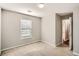 Simple bedroom with neutral walls and carpet at 3375 Wrenwood Ct, Loganville, GA 30052