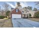 Two-story house with brick and siding, and a two-car garage at 3375 Wrenwood Ct, Loganville, GA 30052