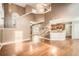 High-ceiling living room with hardwood floors, fireplace, and lots of natural light at 3375 Wrenwood Ct, Loganville, GA 30052