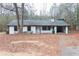 White ranch house with black window frames and attached garage at 3436 Lake Monroe Rd, Douglasville, GA 30135