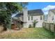 House backyard with deck, wooden fence, and grassy area at 695 Old Johnson Rd, Lawrenceville, GA 30045