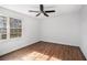 Bright bedroom with wood-look floors and ceiling fan at 7935 Sweetwater Dr, Douglasville, GA 30135