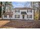 Two-story white house with gray shutters and a brick walkway at 7935 Sweetwater Dr, Douglasville, GA 30135