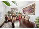Formal dining room with large table, decorative artwork, and hardwood floors at 1178 Fort Marcy Park, Lawrenceville, GA 30044
