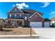 Two-story home with 3-car garage, landscaping, and large front yard at 1178 Fort Marcy Park, Lawrenceville, GA 30044