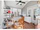 Bright sunroom with tile floor, ceiling fan, and lots of storage at 1178 Fort Marcy Park, Lawrenceville, GA 30044