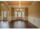 Bright dining room with hardwood floors and a view to the kitchen at 85 Providence Pkwy, Covington, GA 30014