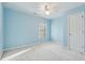 Light and airy bedroom featuring light blue walls and carpet at 1211 Chadwick Point Dr, Lawrenceville, GA 30043