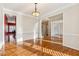 Bright dining room with hardwood floors and crown molding at 1211 Chadwick Point Dr, Lawrenceville, GA 30043