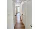 Bright hallway with hardwood floors and white doors at 4409 Idlewood Ln, Tucker, GA 30084