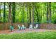 Charming firepit area with seating and a play area at 281 Greencrest Ct, Marietta, GA 30068