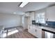 Modern kitchen with white cabinets, granite countertops, and subway tile backsplash at 8205 Kirk Sw St, Covington, GA 30014