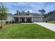 Two-story house with brick accents, a covered porch, and a three-car garage at 1999 Gladys Ct, Marietta, GA 30064