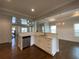 Open kitchen with island, stainless steel appliances, and white cabinets at 1999 Gladys Ct, Marietta, GA 30064