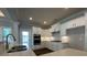 Modern kitchen with white cabinets, stainless steel appliances, and quartz countertops at 1999 Gladys Ct, Marietta, GA 30064