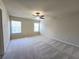 Spacious bedroom with ceiling fan and carpeted floors at 2104 Meadow Peak Rd, Duluth, GA 30097