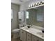 Double vanity bathroom with a large mirror and bathtub at 2712 Windsor Ct, Kennesaw, GA 30144