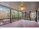 Large deck with wooden railings and ceiling fan at 500 Poplar Creek Xing, Canton, GA 30114