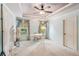 Bright bedroom with a desk, large windows, and neutral decor at 3215 Kylee Dawn Cir, Lawrenceville, GA 30045