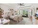 Bohemian-style bedroom with a comfy sitting area and large windows at 3215 Kylee Dawn Cir, Lawrenceville, GA 30045