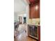 Butlers pantry with wine cooler and granite countertop at 3215 Kylee Dawn Cir, Lawrenceville, GA 30045