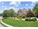 Brick and stone home with landscaped yard and driveway at 3215 Kylee Dawn Cir, Lawrenceville, GA 30045