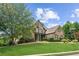 Two-story home with stone and brick exterior, lush lawn at 3215 Kylee Dawn Cir, Lawrenceville, GA 30045